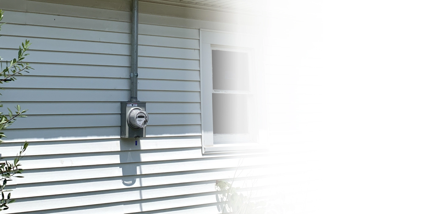 electric meter installed outside a house